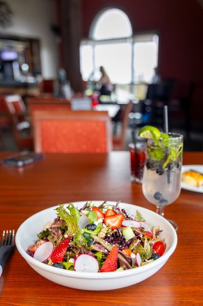 Fresh strawberry salad and a cocktail at Rodd Crowbush Golf & Beach Resort, a premier Crowbush restaurant venue
