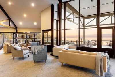 Lobby lounge area overlooking the lake in the Main Lodge at Freycinet Lodge