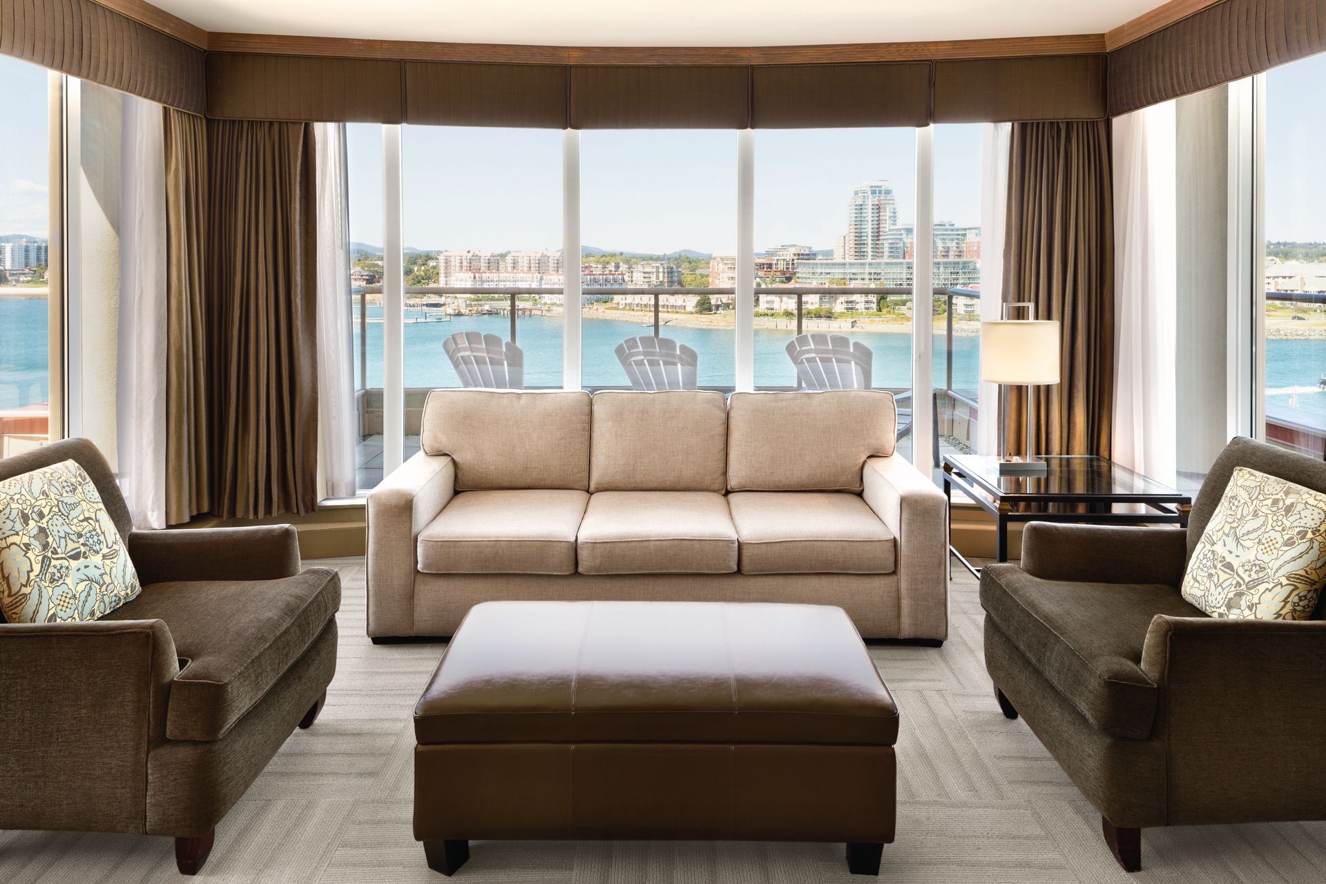 Living area with balcony and view of water