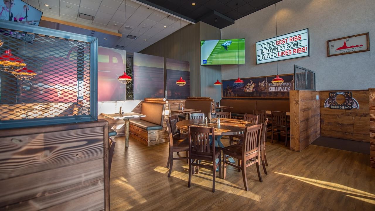 Hotel restaurant with wooden tables and chairs.