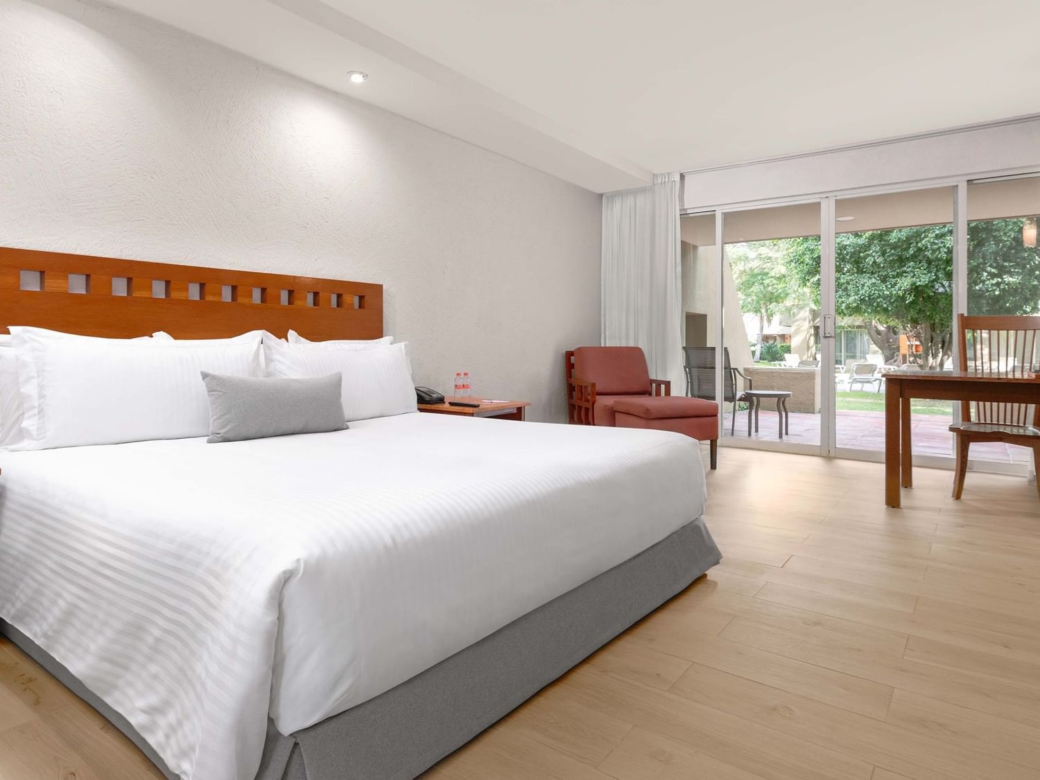 King bed, desk, and balcony in King Ambassadors Suite at Camino Real Guadalajara in Zapopan