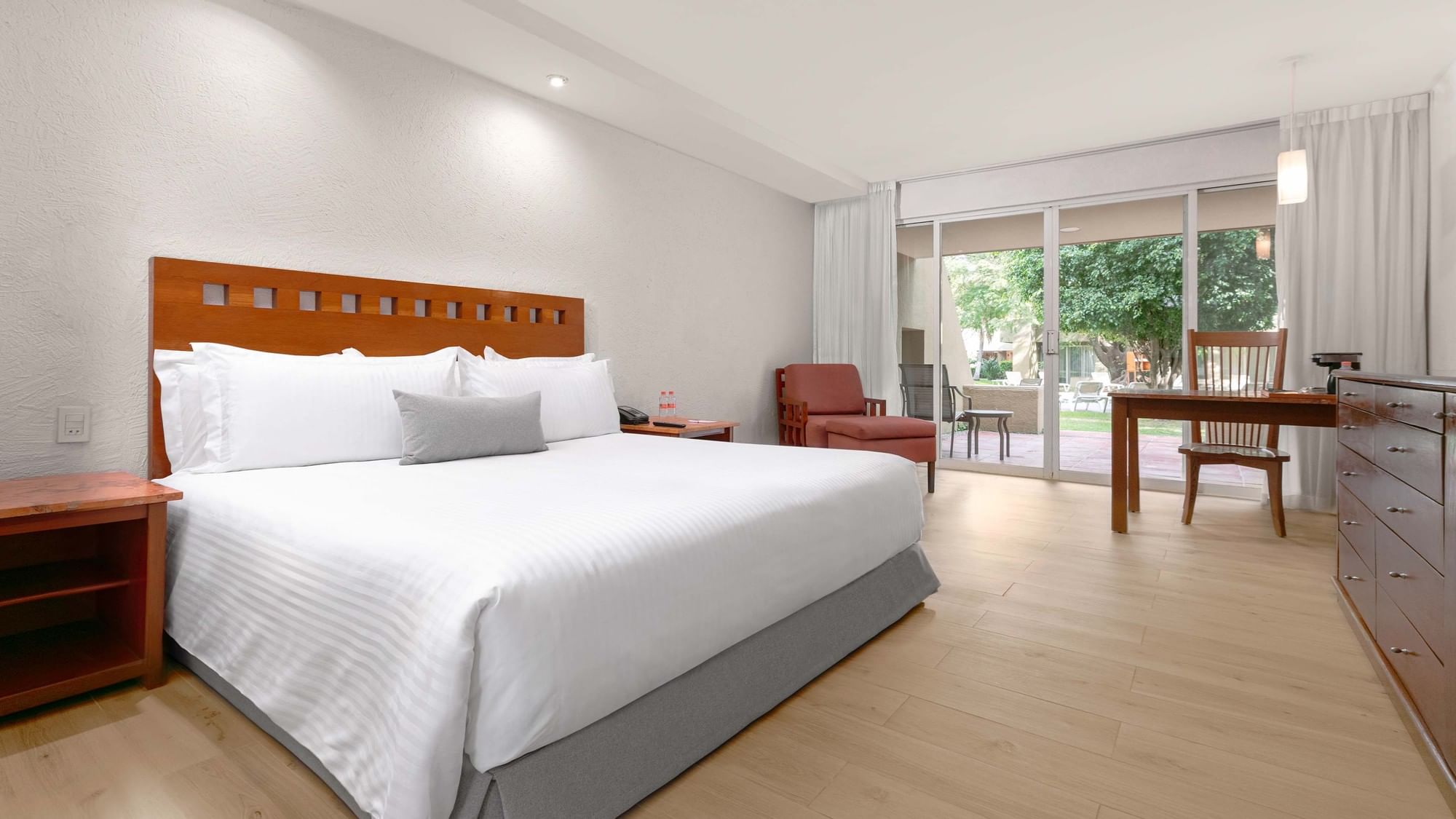 King bed, desk, and balcony in King Ambassadors Suite at Camino Real Guadalajara in Zapopan