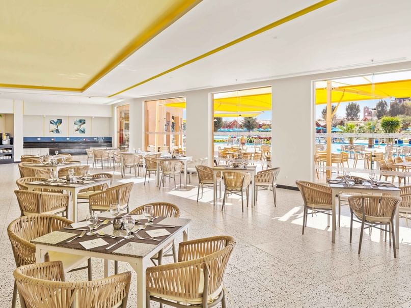 Dining area with poolside view at Zum Kaiser in Pickalbatros Jungle Aqua Park Resort - Neverland Hurghada, Red Sea Governorate.