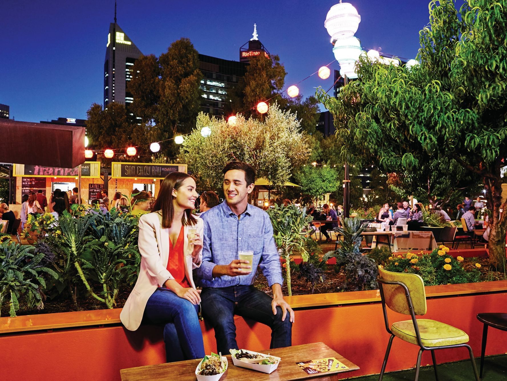 Couple dining in Perth Cultural Centre near Nesuto Mounts Bay