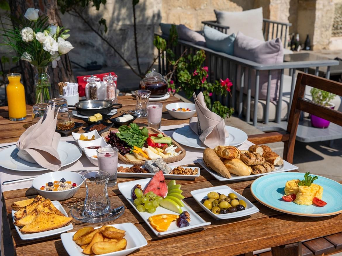 Served dishes on a table in Sitara Restaurant at Senses Hotel