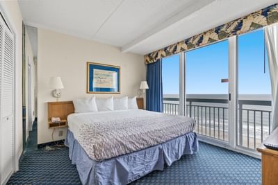Cozy bed with a sea view in Deluxe One Bedroom at The Yachtsman Resort