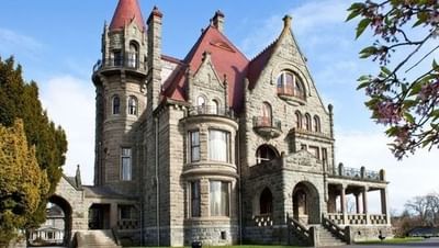 A stunning daytime shot of Craigdarroch Castle a historic mansion and a short drive from Embassy Inn Victoria