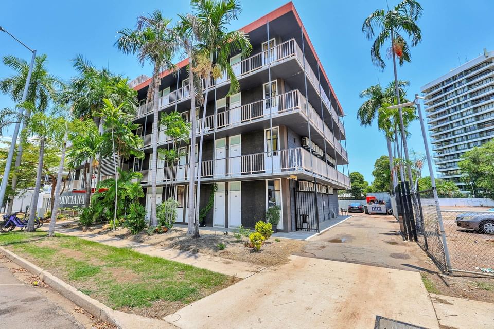 Darwin Poinciana Inn surrounded by palm trees