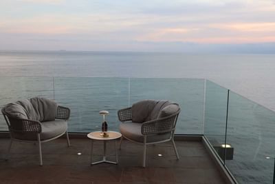 Two loungers on terrace at Sublimis Boutique Hotel Camogli in the evening