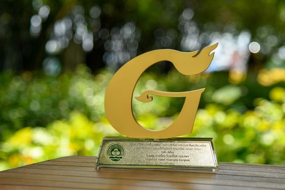 Green Hotel award placed on an outdoor table, Chatrium Hotel
