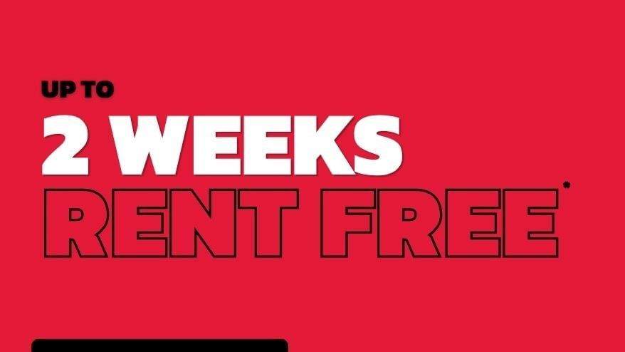Promotional banner offering up to 2 weeks rent free at UniLodge Melbourne City with apply now button on red background