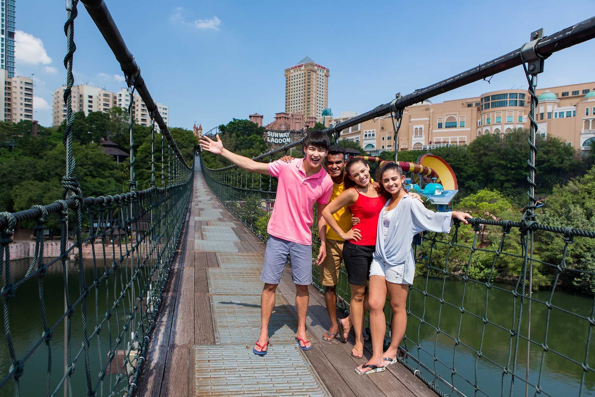 A group posing on a bridge at Amusement Park near Sunway Resort