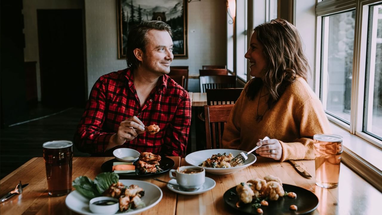 A couple enjoys a meal at a Canmore restaurant.