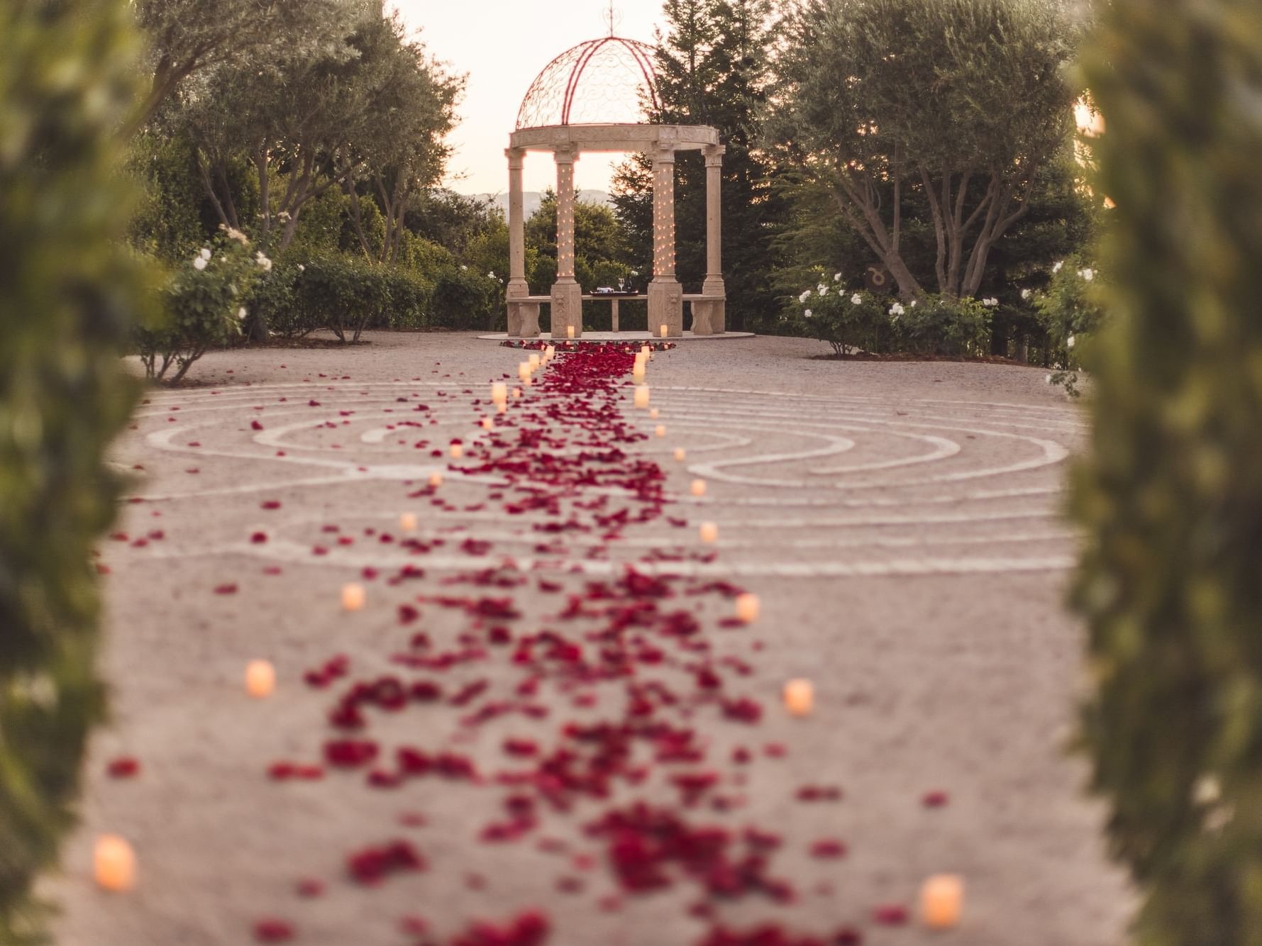 Rose petals leading up to Stone Gazebo