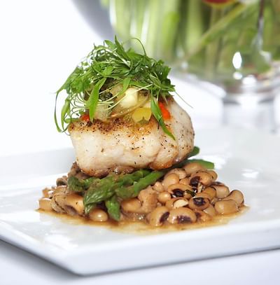 Pan-seared fish fillet served in Asher\’s Lounge and Patio at Spencer Hotel, a top choice for fine dining London Ontario