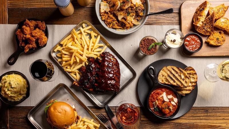 Flat lay image of a number of dishes at Outback Steakhouse Penrith