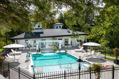 The Crooked Cabana with outdoor pool, lounge chairs, and a stylish pavilion at The Roxbury