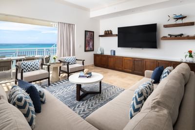 TV lounge area with plush seating in 4 Bedroom Oceanfront Penthouse w/ Roof Terrace at Windsong Resort On The Reef