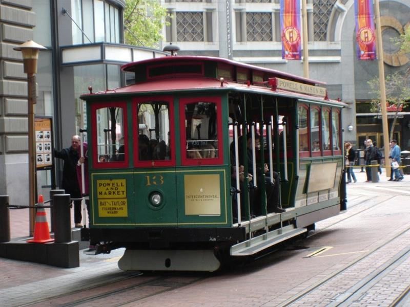 Cable car number 13 at the street in San Francisco.