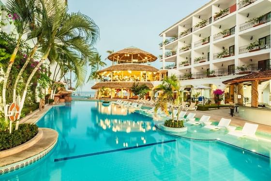 Sunbeds by the outdoor pool area at Los Arcos Suites