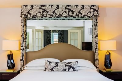 Close-up of a queen bed in a bedroom at The Eliot Hotel