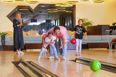 A family bowling at Bay La Sun Hotel & Marina