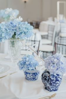Close-up of a banquet table decor with blue flower & China pots at Sebasco Harbor Resort