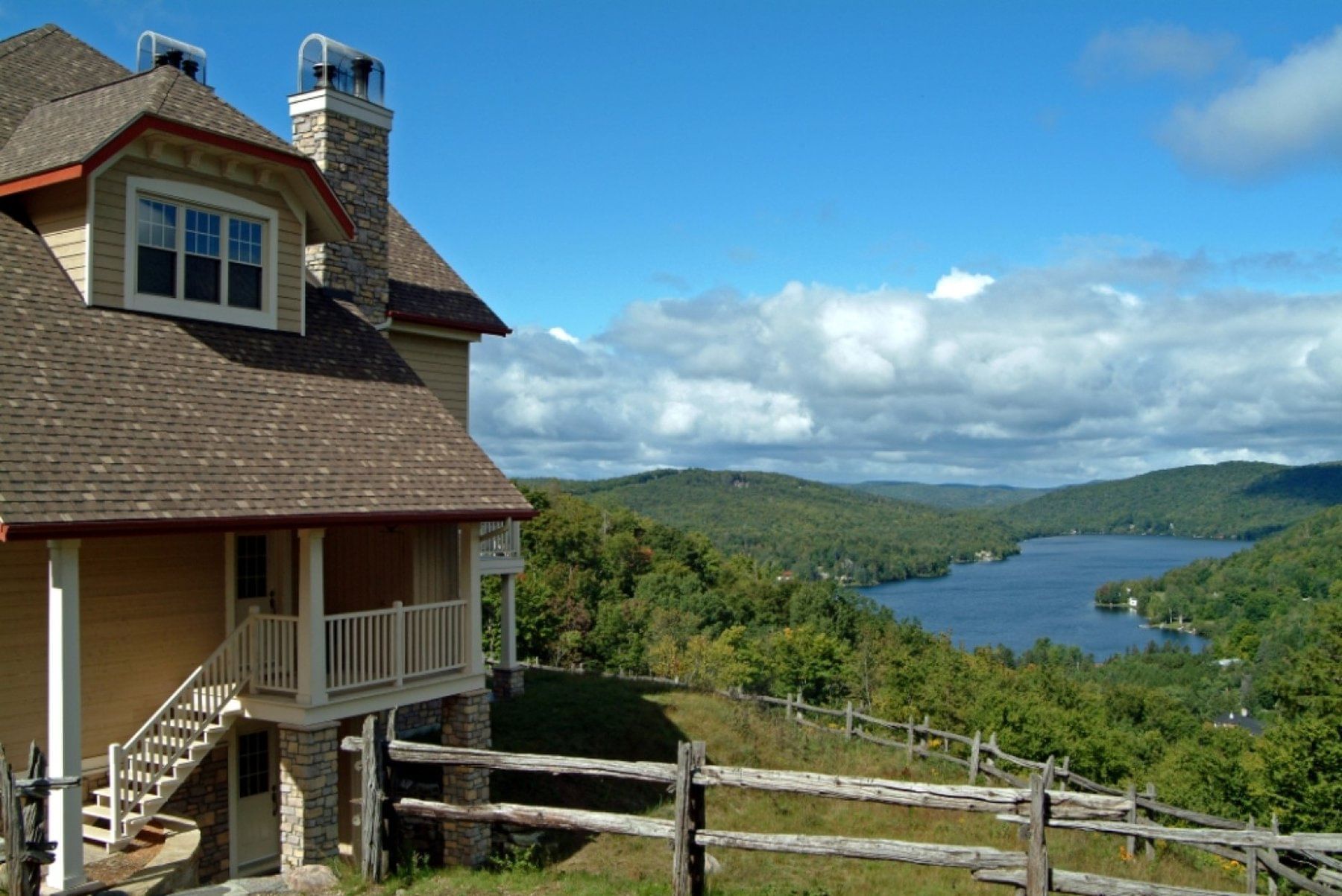 Exterior of resort with lake in background