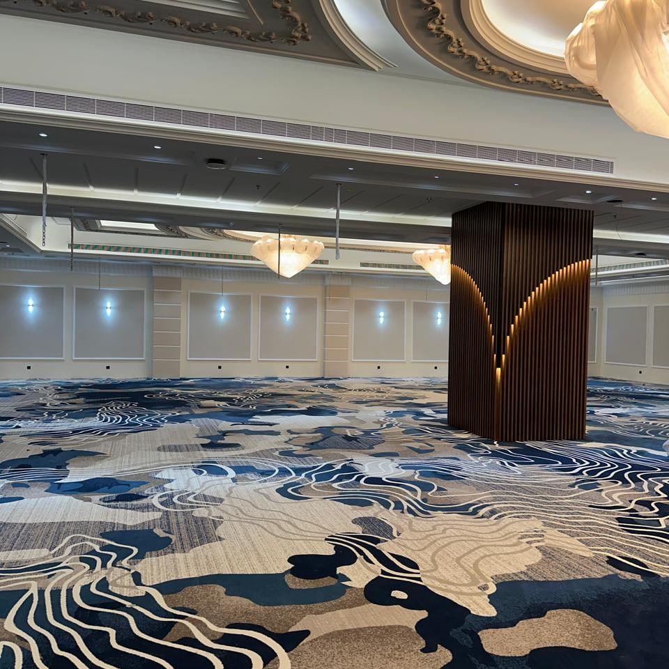 Elegant Warwick Club Lounge at Jeddah Hotel & Spa in جدة with grand decor and luxurious carpet.