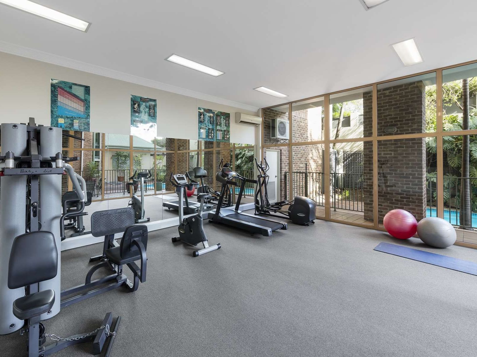 Exercise machines arranged in the gymnasium at Nesuto Hotels