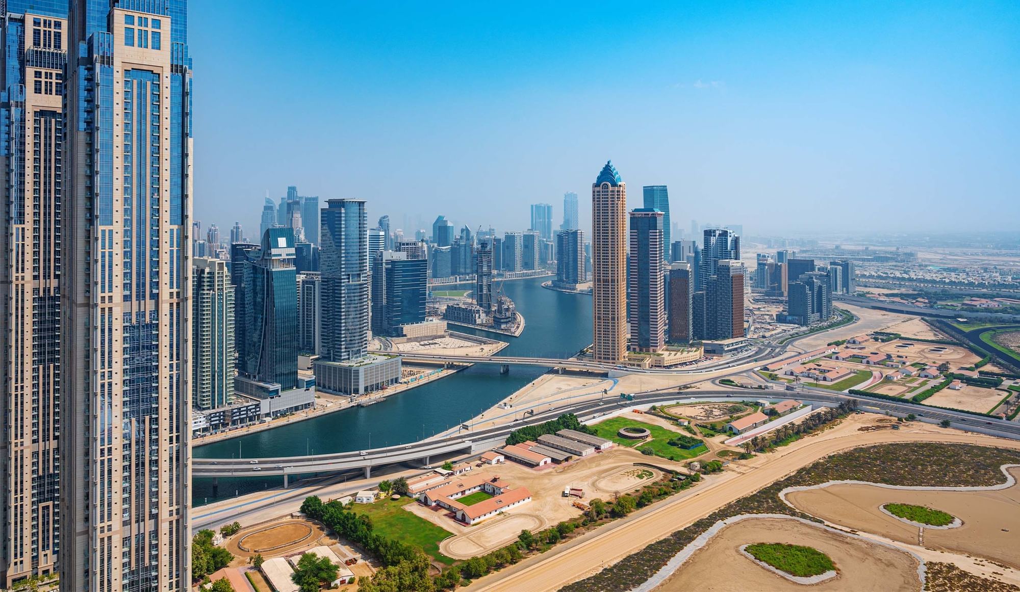 Distant view of Dubai's towering skyline near DAMAC Maison Aykon City