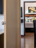 One Bedroom Villa interior with dining area and bed visible at Tokatoka Resort - Fiji International Airport, Nadi.