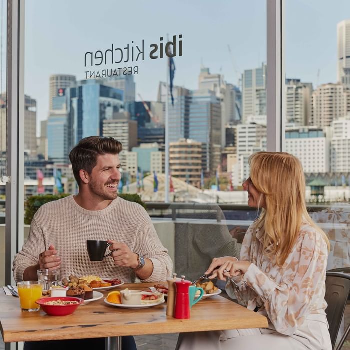 Couple eating breakfast at ibis restaurant