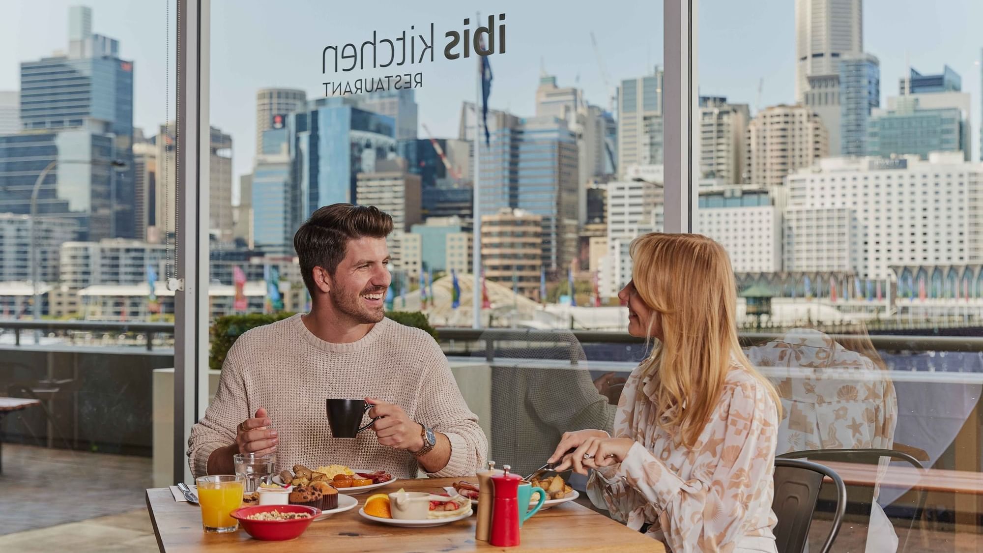 Couple eating breakfast at ibis restaurant