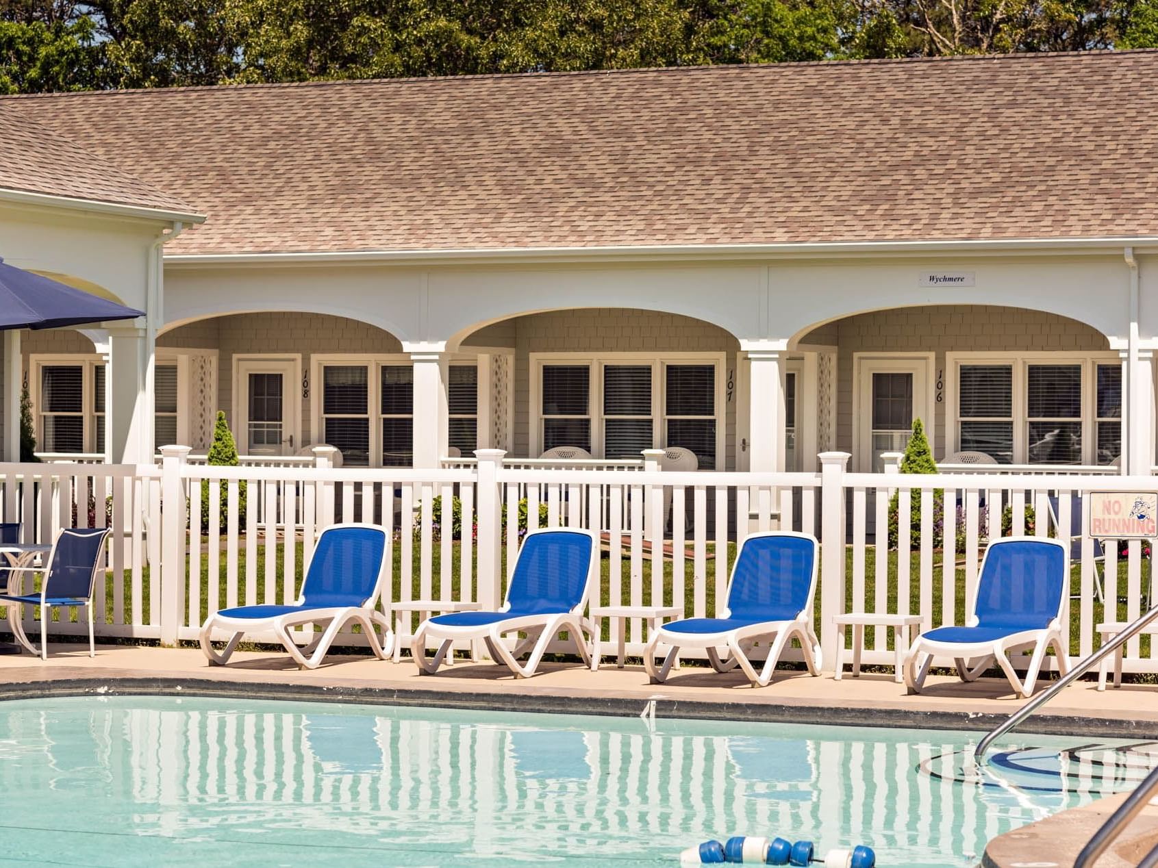 Outdoor pool with pool beds at Pelham on Earle