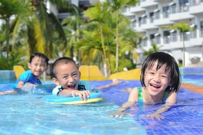 Three kids enjoying in the pool