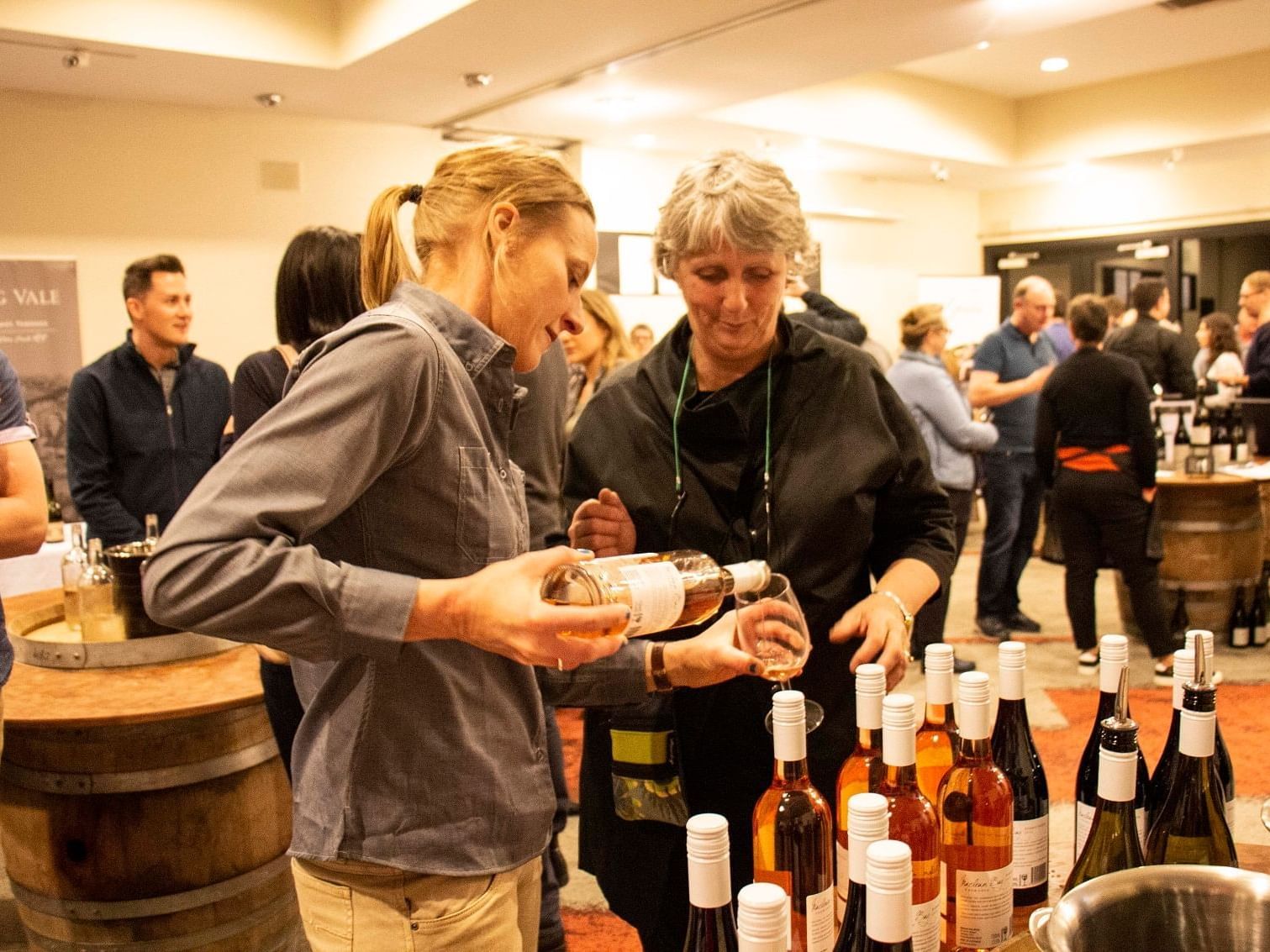 Two women near a wine station at Freycinet Lodge