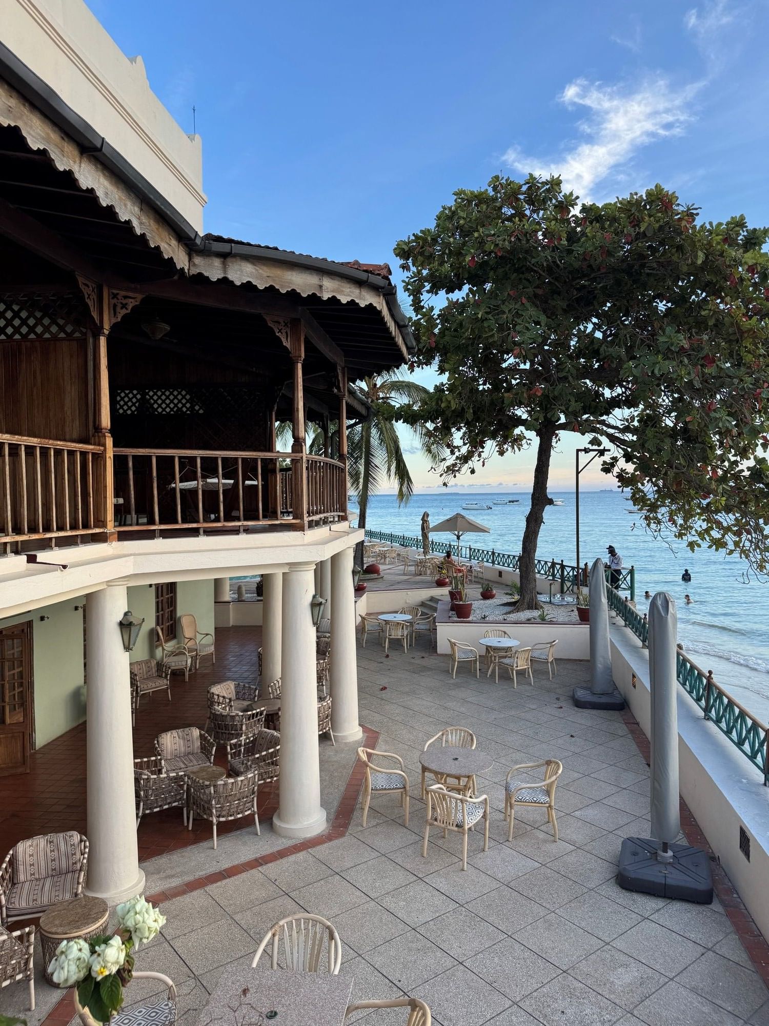 Outdoor dining area with ocean view at Masahani Bar, Zanzibar Serena Hotel in Zanzibar.