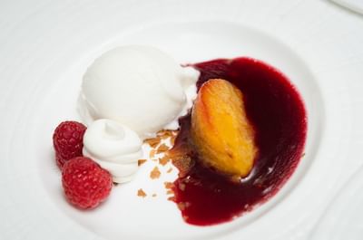 Peach Melba, a classic french dessert prepared by pears, served in a restaurant at The Stanley Hotel