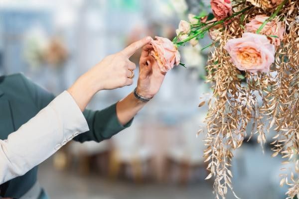 Couple looking at decor at wedding showcase