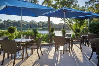 Outdoor dining & lounge area with Lake view at Trianon Bonita Bay