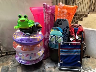 Inflatable toys & surfboards stacked at Stay Hotel Waikiki