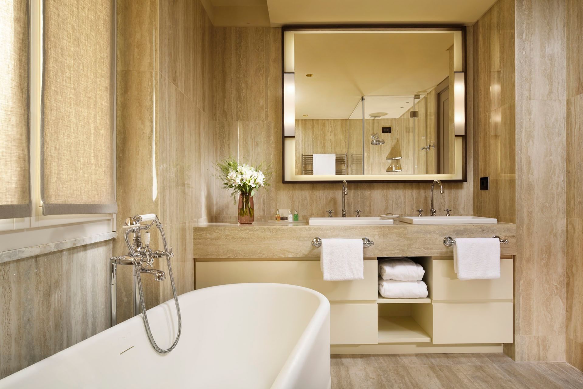 Bathroom Vanity & amenities featuring bathtub in Classic Suite at Margutta 19