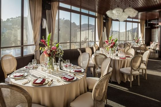 Arranged tables in the Rodeo Meeting Room at Hotel Angeleno
