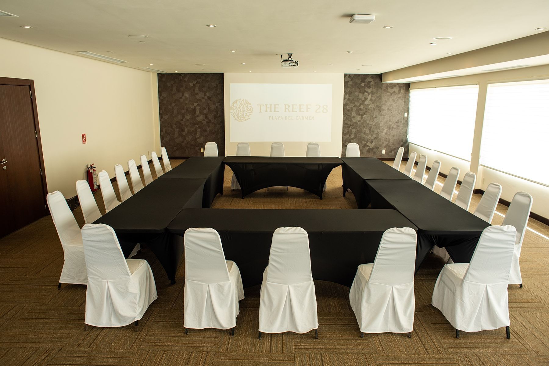 Meeting space with boardroom table set up at The Reef 28