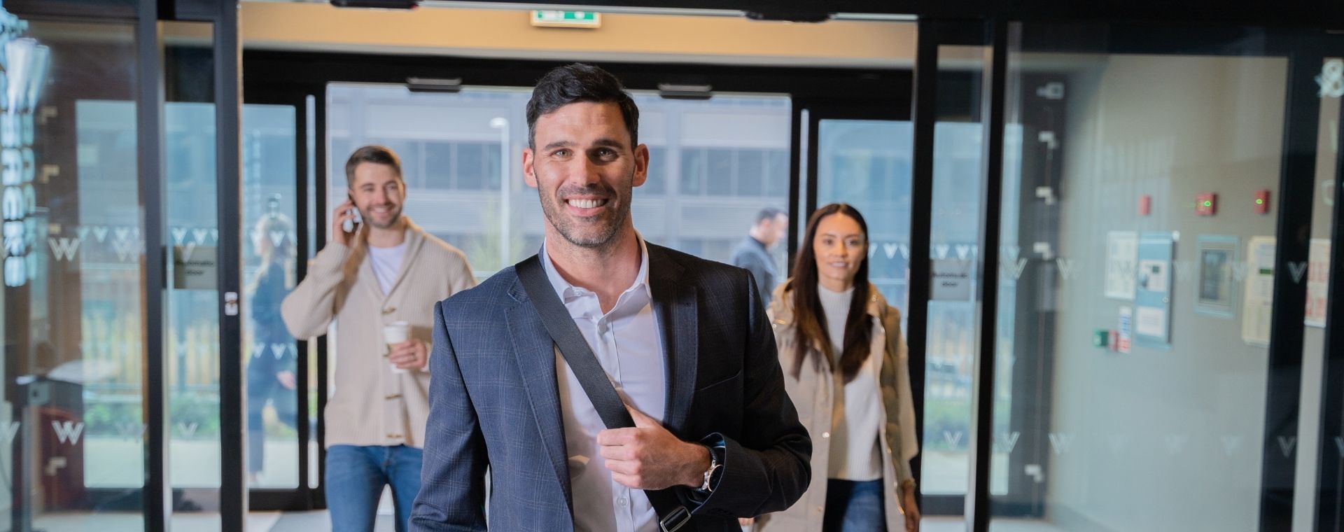 People walking through the main entrance at Village Hotels