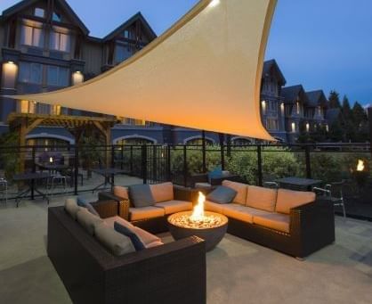 Fireplace by the outdoor lounge area at Aava Whistler Hotel