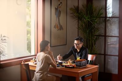 Couple enjoying their meal at Hanoi Daewoo Hotel