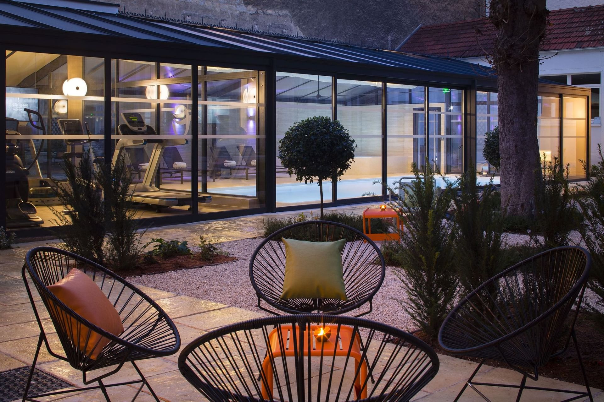 Outdoor lounge area by Fitness Centre at Oceania Le Jura Dijon