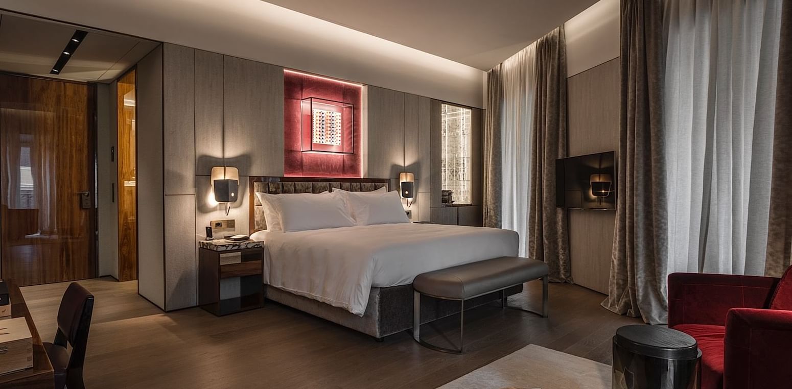Comfortable bed in Deluxe Suite 3 at Fendi Private Suites